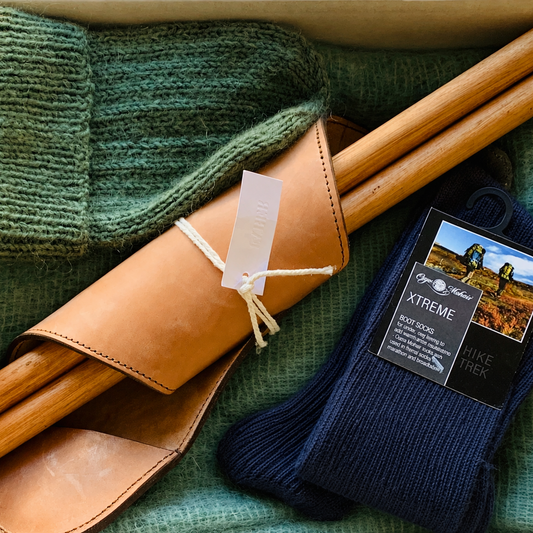 Gift box with leather folding chair, mohair socks, mohair beanie and mohair blanket. 
